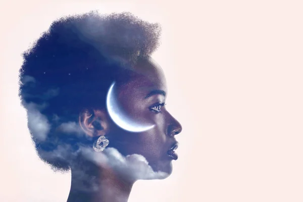 Woman profile silhouette portrait with moon and clouds in her head. Sleep and menstrual cycles concept.