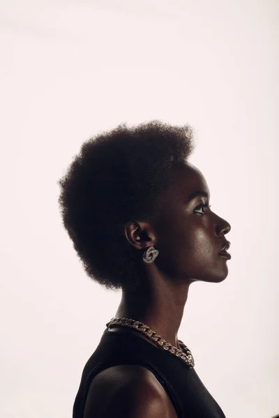 Close up portrait of african american woman with afro hairstyle on white studio background — Stock Photo, Image