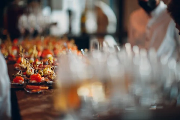 Food catering appetizers snacks on a tray on table — Stock Photo, Image