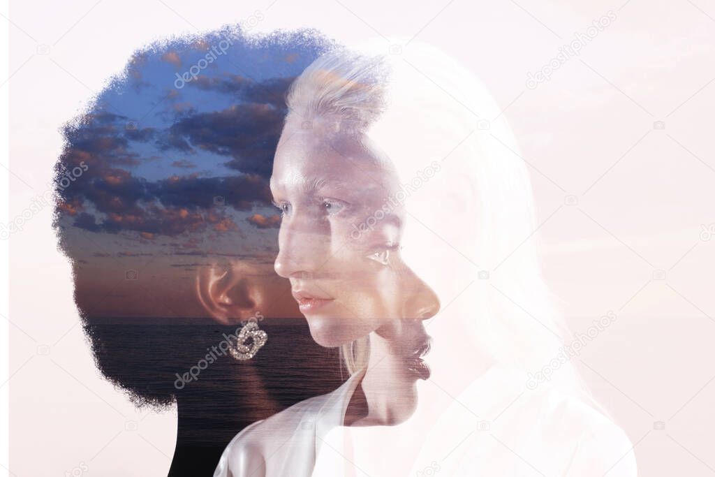 Caucasian and african american young woman isolated on black background.