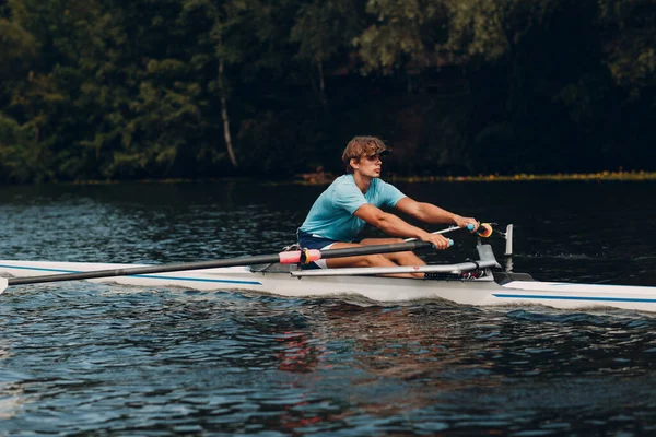 Sportsman single scull man rower prepare to competition boat regatta. Olympic games sport. — Stock Photo, Image