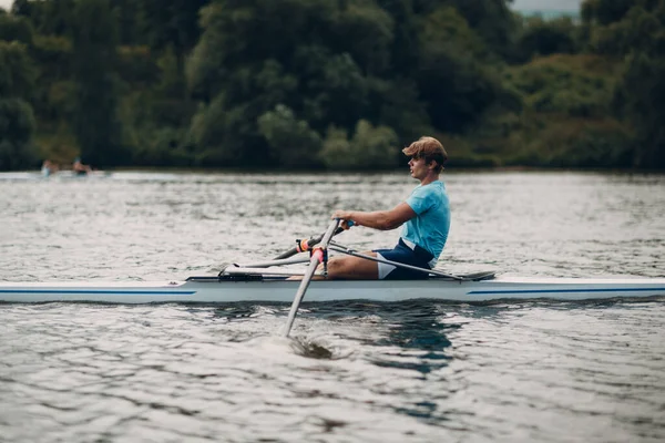 Sportsman single scull man rower rowing on boat — Stock Photo, Image