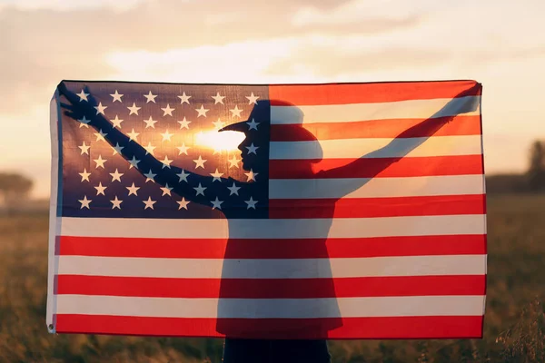 Woman shadow silhouette behind the American Flag on sunset — Stock Photo, Image