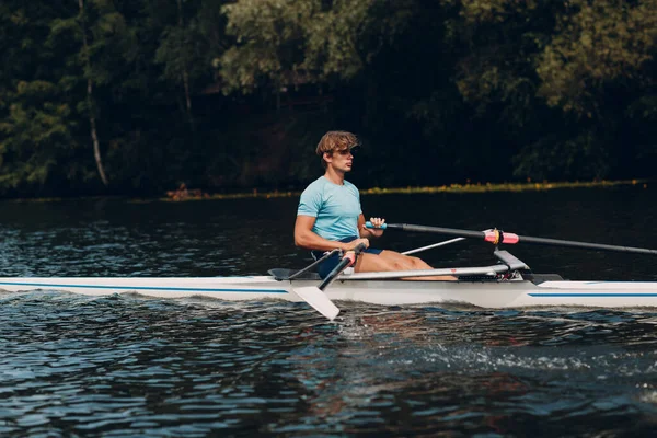 Sportsman single scull man rower rowing on boat — Stock Photo, Image