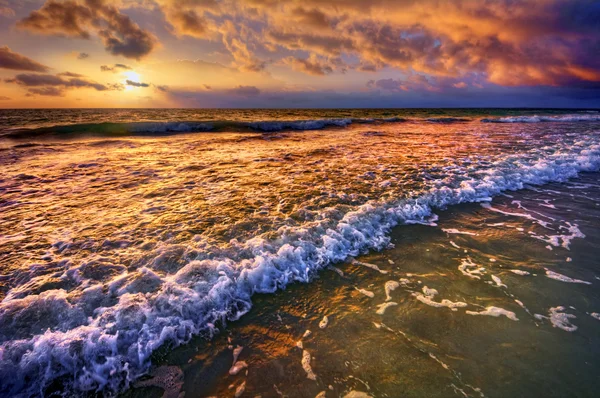 Placid shore and whimsical clouds