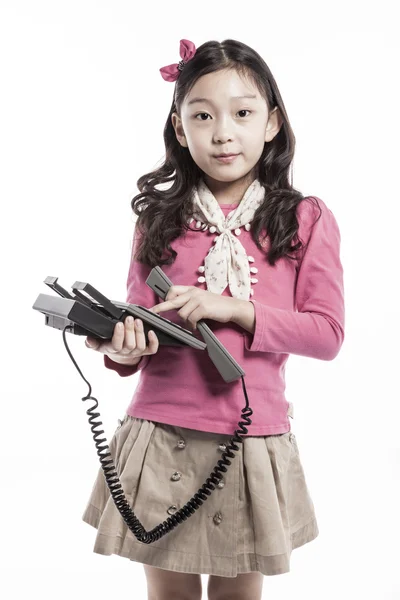 A kid wearing pink blouse, white scarf with paper bag. — Stock Photo, Image