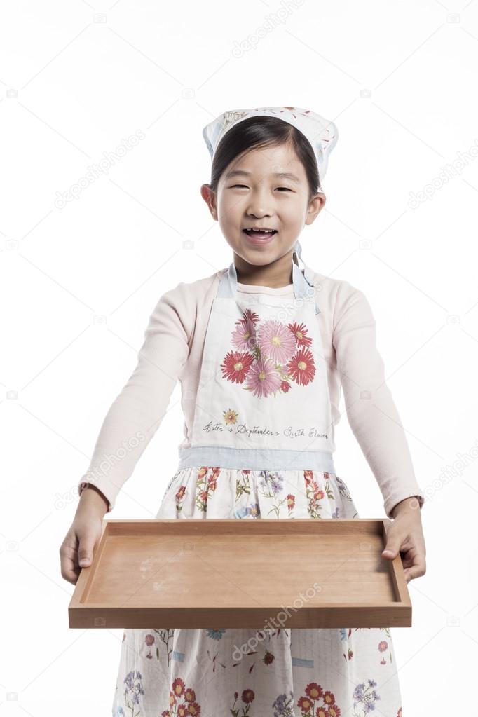 A child in a kitchen.