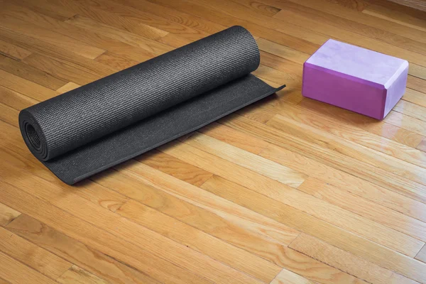 Yoga Mat and Pink Brick