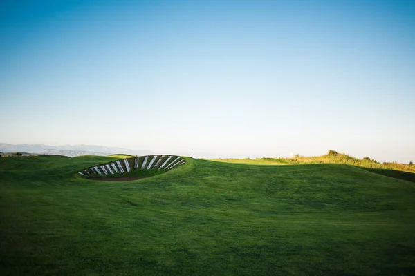 Golf pálya naplementekor — Stock Fotó