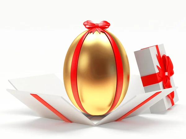 Ovo de Páscoa dourado em uma caixa de presente aberta — Fotografia de Stock