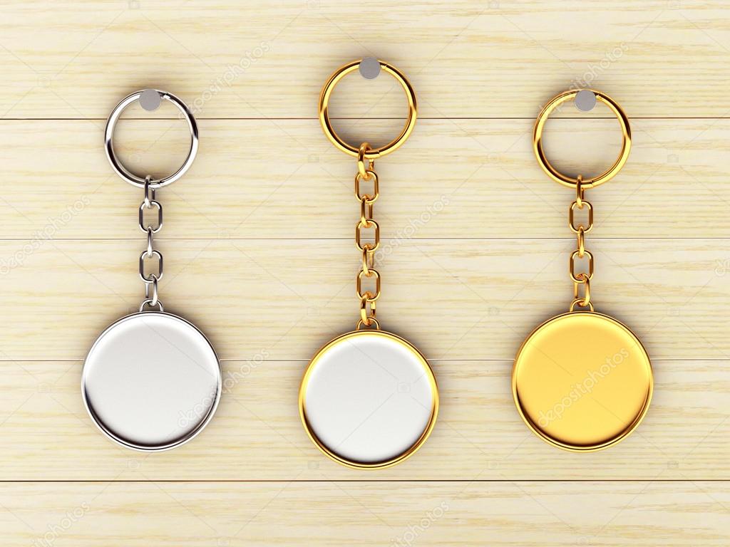 Set of blank round golden and silver keychains is hanging on the