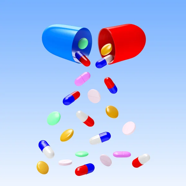 Színes tabletták csökken a kapszula — Stock Fotó