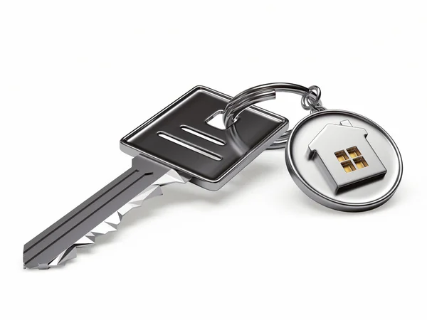 Zilveren sleutel en ronde keyc hain met huis — Stockfoto