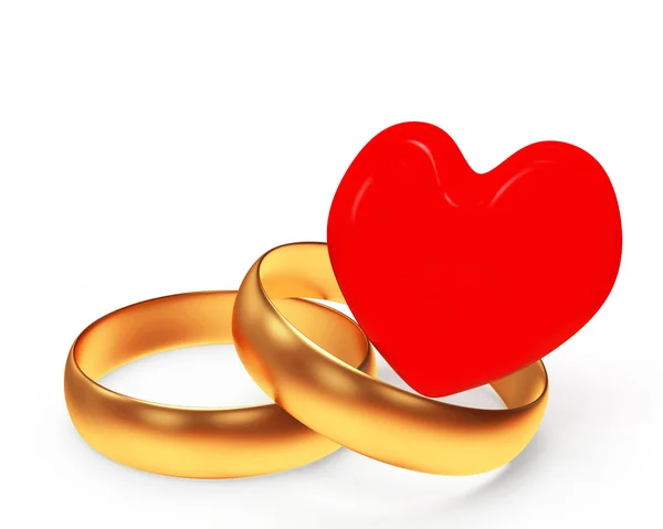 Golden wedding rings and red heart — Stock Photo, Image