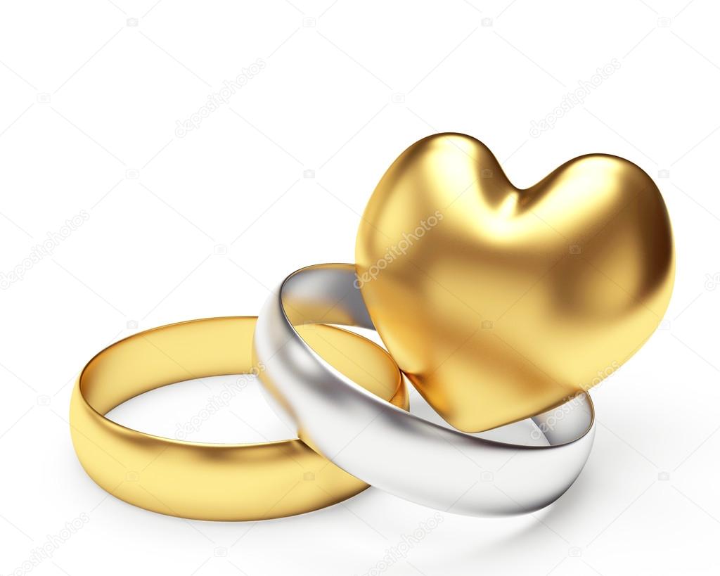 Golden and silver wedding rings and heart