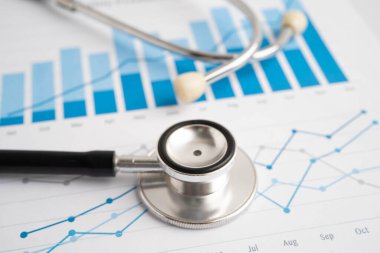 Çizelge üzerinde steteskop veya grafik kağıdı, Finansal, hesap, istatistik ve iş verileri tıbbi sağlığı.