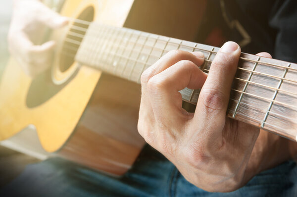 Man playing acoustic guitar 