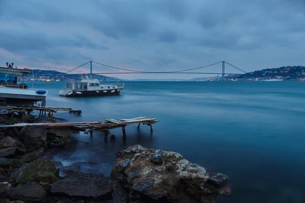 Bosphorus bridge and tugboat