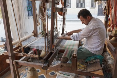 Yilmaz Buyukasik weaving silk clipart