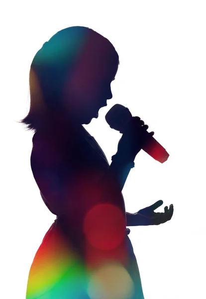 Singing young girl with microphone — Stock Photo, Image