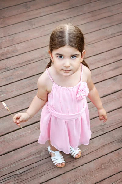 Cute girl with candy — Stock Photo, Image