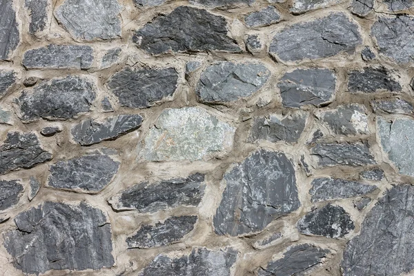 Pared de piedra de piedra gris variedad envejecida — Foto de Stock