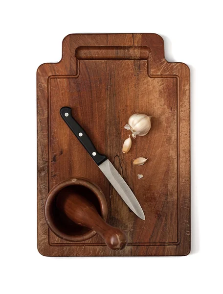 Garlic on wooden cutting board — Stock Photo, Image