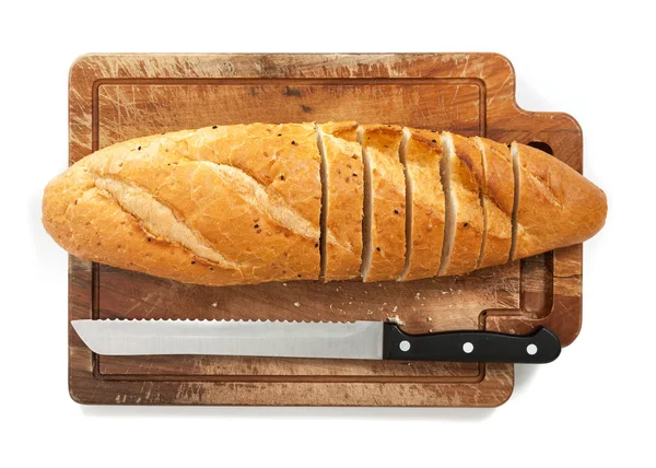 Pão fatiado e faca — Fotografia de Stock