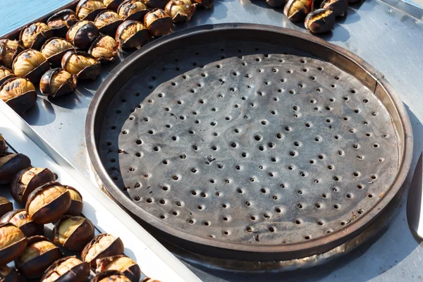 Metal stand for frying chestnuts — Stock Photo, Image