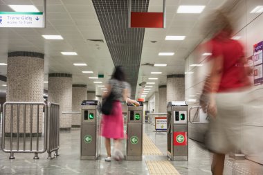People at the turnstiles in Istanbul Metro
