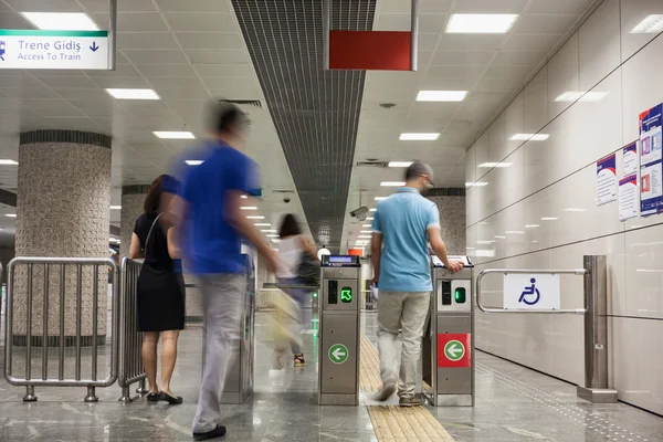 People at the turnstiles in Istanbul Metro — Stok fotoğraf