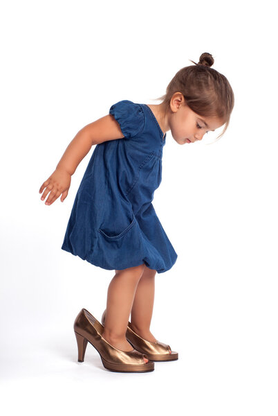 Little girl in high heel shoes