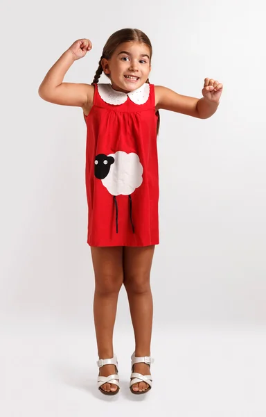 Cute little girl in red dress — Stock Photo, Image