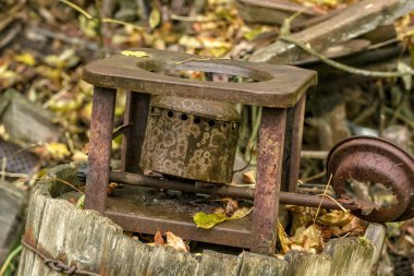 Thrown out into the street, broken old kerosene gas.