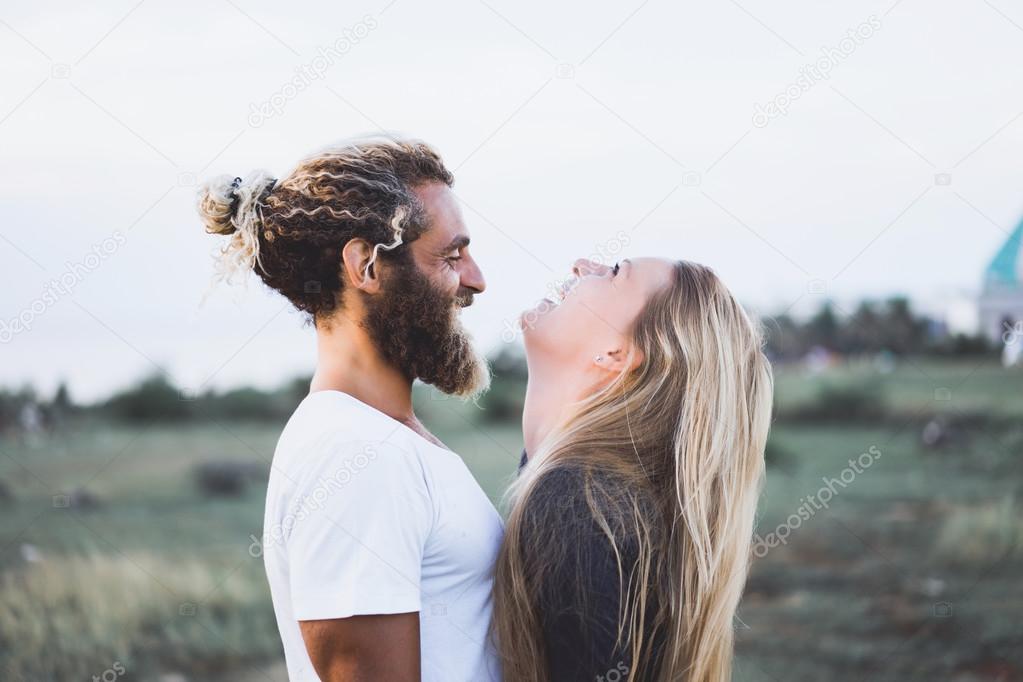 young happy couple posing in the nature