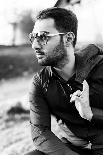 Young guy in sunglasses with a beard — Stock Photo, Image