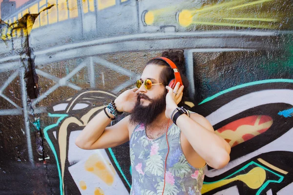 Guy with  listening  music with headphones — Stockfoto