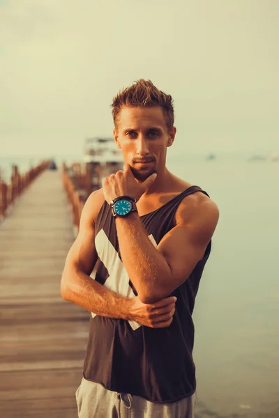 Young bearded man  standing on pier — Stock Photo, Image