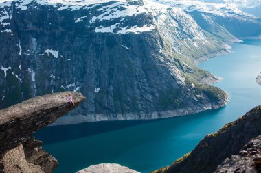 girl   on a rock , Norway fjords