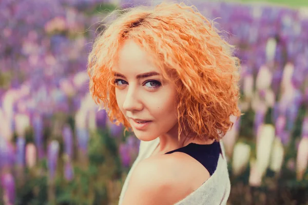 Red-haired girl in a field of lavender — Stock Photo, Image