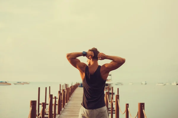 Young bearded man  standing on pier — Stock Photo, Image