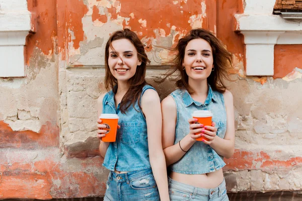 brunette girlfriends drinking coffee