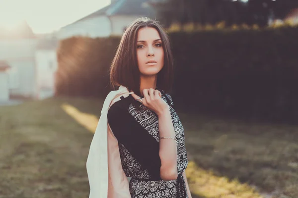 Girl posing in the street in sunlight — Stock Photo, Image