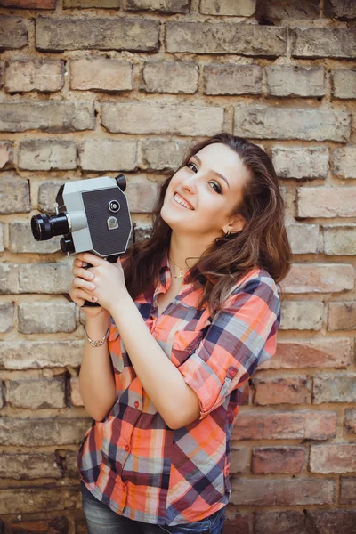 Girl posing in the street with camera — 스톡 사진