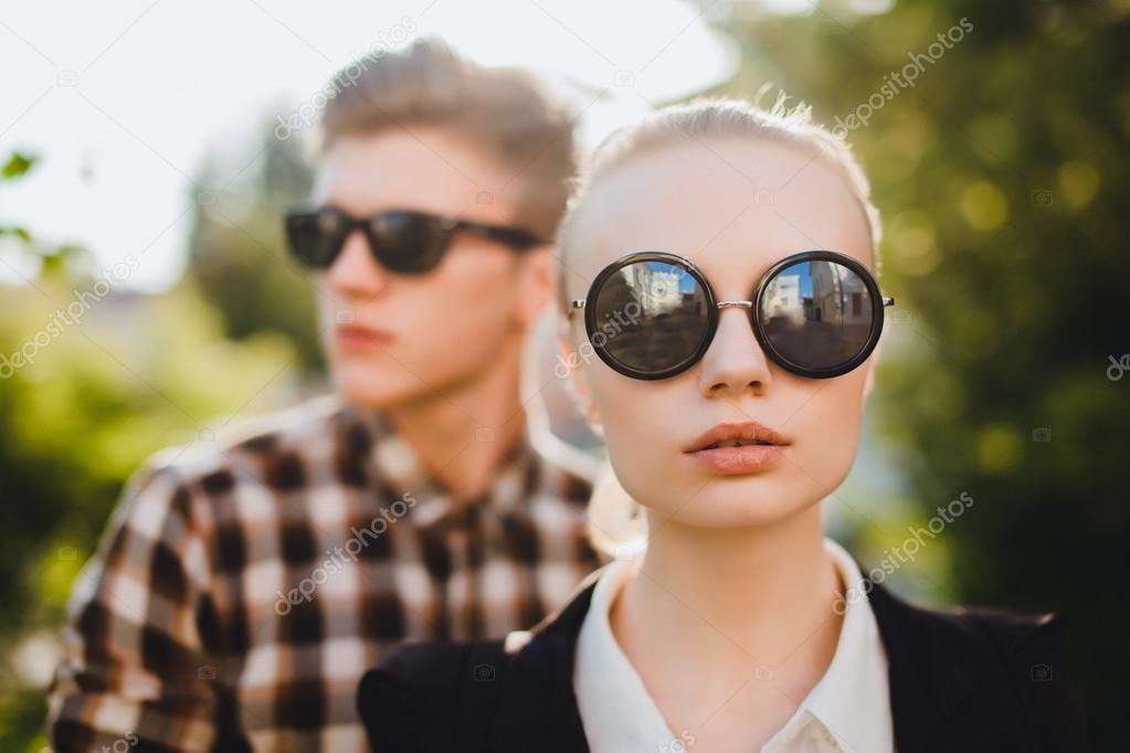 fashionable couple in sunglasses