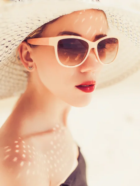 Young beautiful girl in a large hat — Stock Photo, Image