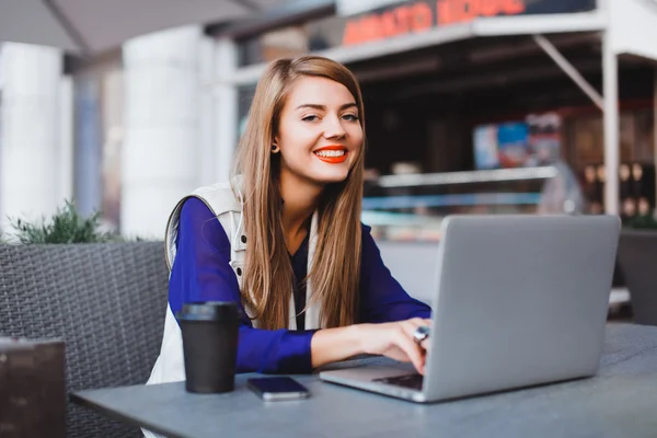 Woman sitting with laptop — Stock Photo, Image