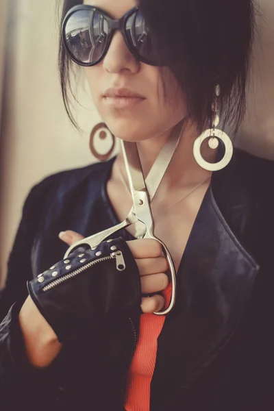 Young girl  in sunglasses with scissors — Stock Photo, Image