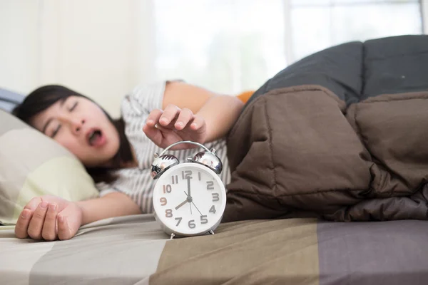 Young woman getting stressed about waking up too early, shallow