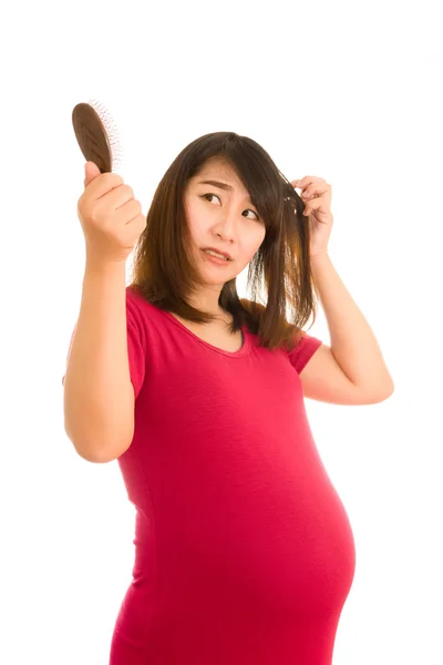 Azjatyckie dziewczyny w ciąży martwi się o wypadanie włosów, wypadanie włosów Zdjęcie Stockowe